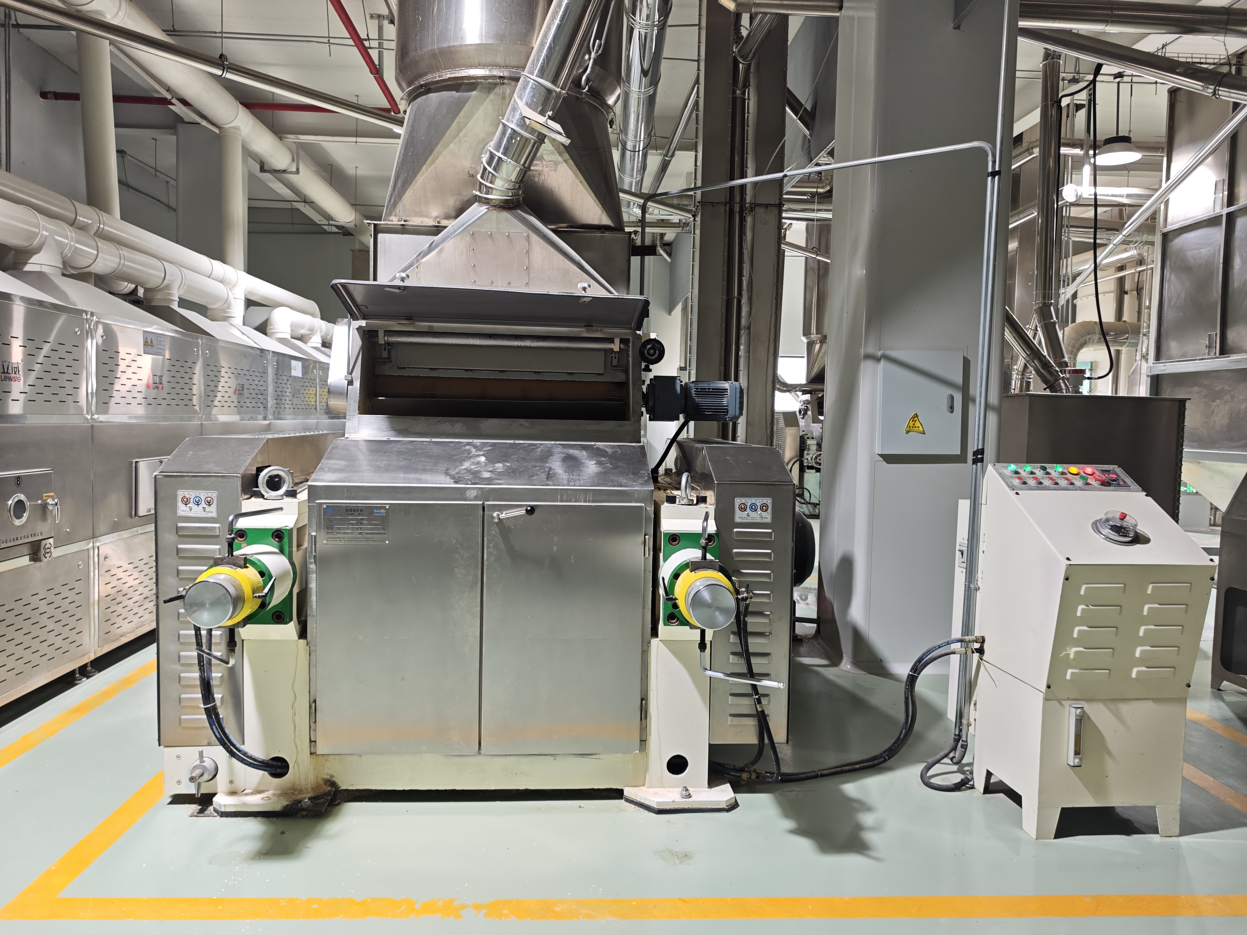 Oat flaking machine in workshop environment